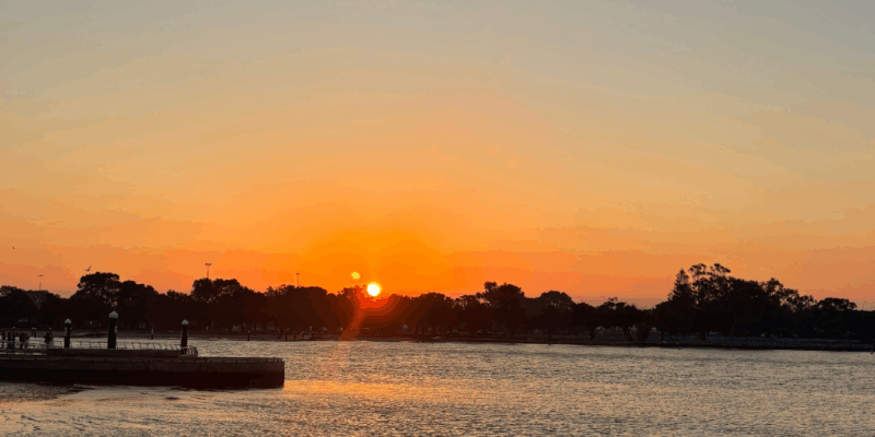 Golden summer sunset over the ocean, symbolising reflection, warm